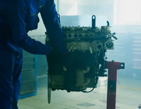 Technician diagnosing a vehicle in the McCoy Enterprises shop